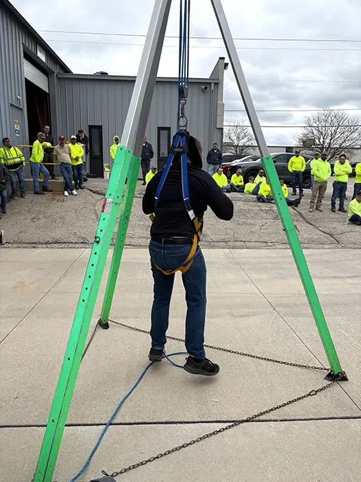Osha safely instructor demonstrating in harness